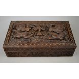 A Chinese carved teak cigar box, the top