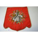 A red ground wool tapestry panel with ce