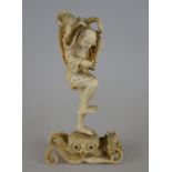 A Japanese carved ivory okimono of an elderly fisherman, wrestling with the octopus in the basket on