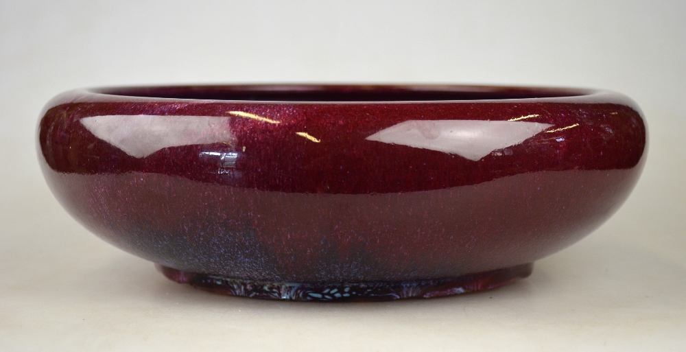 A 19th century Chinese sang de boeuf-glazed bowl with rolled rim, on shallow foot, 30 cm diam - Image 3 of 3