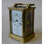 A brass carriage clock with alarm action striking on a bell, 12 cm high Condition Report ticking -