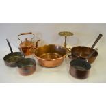 A Victorian copper and brass kettle on cast brass tripod trivet, to/w two copper preserving pans and