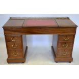 A Victorian mahogany pedestal slope-top clerk's desk, the centre hinged slop enclosing a well and