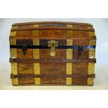 A leather clad and brass bound domed trunk with fitted tray, 58 x 83 x 50 cm Condition Report 57
