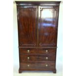 A Victorian mahogany linen press having a pair of beaded panel doors enclosing five slides over