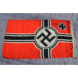 A World War II German Kreigmarine flag, red ground with printed black/white swastika retaining