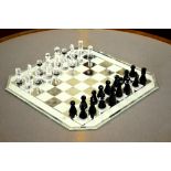 A Swarovski glass chess set with board,