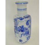 A Chinese porcelain blue and white rouleau vase, decorated with seated ladies pursuing courtly