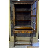 An oak glazed display cabinet/bookcase r
