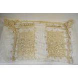 A linen bed cover finely worked with cut-out and tape worked lace inserts featuring birds,