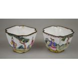 A pair of Chinese Canton enamel small wine cups, one decorated with a man in a window, women in