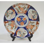 A Japanese Imari charger decorated in un