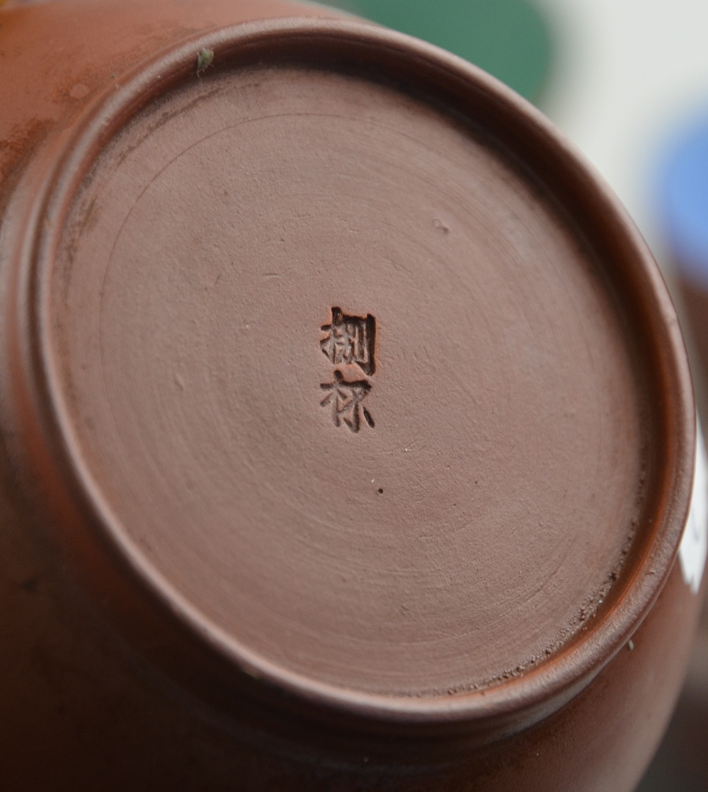 Three Yixing teapots, one incised with calligraphy to/w four tea bowls with glazed interiors (7) - Image 2 of 4