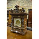 A late 19th century ormolu mounted oak mantel clock, the eight-day movement by Lenzkirch with