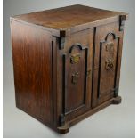 A Victorian oak smokers cabinet in the f