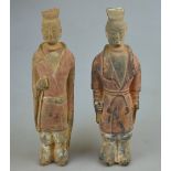 Two Chinese Tang dynasty tomb attendants both having traces of original pigment, 28.5 cm Condition