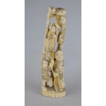 A Japanese carved marine ivory okimono group, old man with children on a ladder, 25 cm high (c.1900)