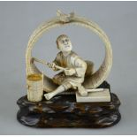 A Japanese carved ivory okimono of a cooper making a large barrel, pausing to admire a songbird