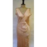 A 1930's peach silk satin and lace night