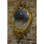 A 19th century gilt framed oval wall mir