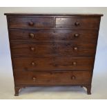 A George III mahogany chest of two short over four long graduated cockbeaded drawers, each with