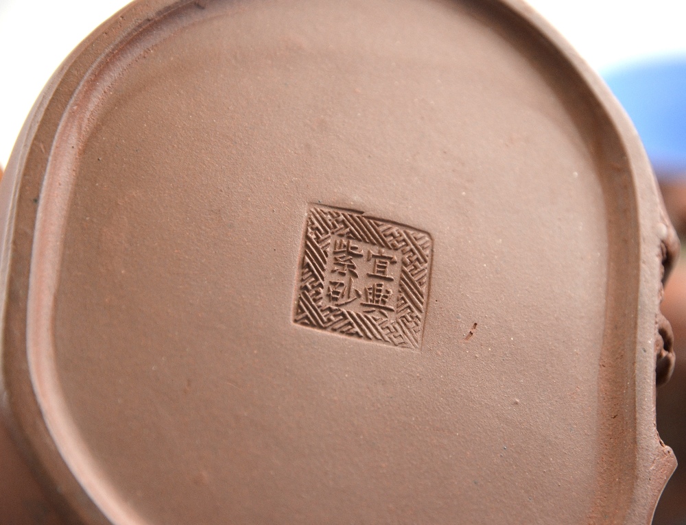 Three Yixing teapots, one incised with calligraphy to/w four tea bowls with glazed interiors (7) - Image 4 of 4