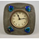 An Archibald Knox design Tudric pewter desk clock with Art Nouveau foliate design and enamel hearts,