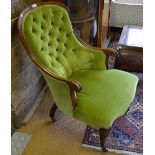 A Victorian rosewood framed button backed elbow salon chair