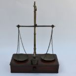 A set of brass and mahogany travelling scales with sectional pillar, the base fitted with a drawer,