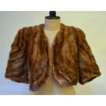 A shadowed mid-brown mink bolero-shaped evening jacket,