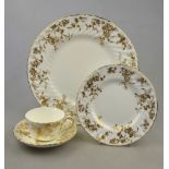 A Minton 'Gold Ancestral' bone china part dinner/tea service comprising eight 27 cm plates, eight 20