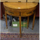 An 18th century rosewood cross-banded mahogany double fold-over demi-lune tea and games table,