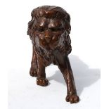 A heavy brown patinated bronze free-form sculpted lion,