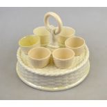 Belleek first period black mark 1863-90 - A circular basket weave egg cup stand with hand and ring