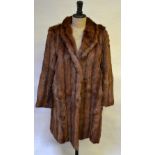 A shadowed coney fur coat with brown satin lining, 52 cm across chest, to/w a blond musquash fur