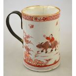 A Chinese Imari tankard decorated with a boy and water buffalo in a rocky landscape with pine