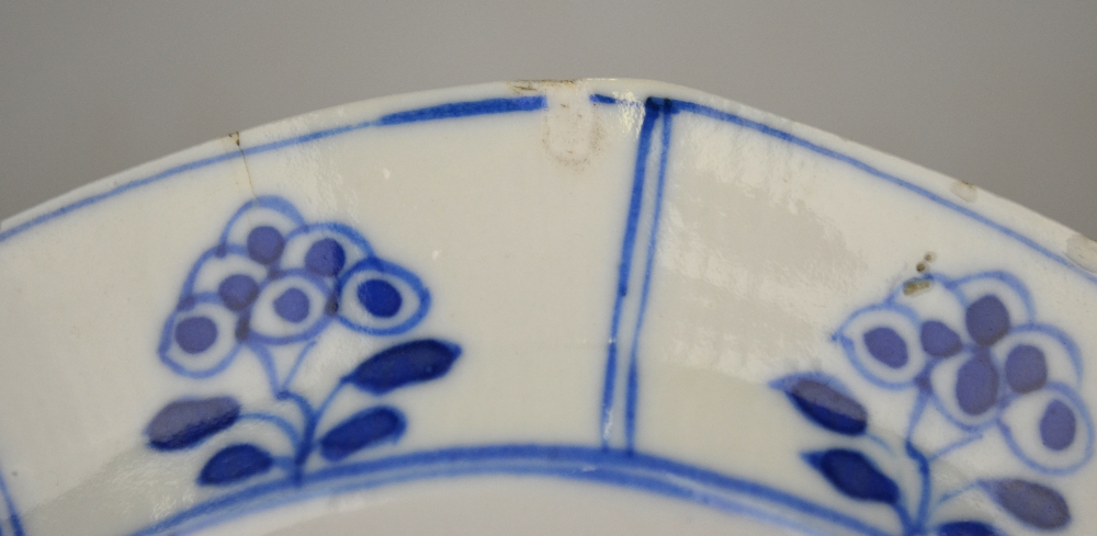 A Chinese blue and white moulded saucer decorated with panels of foliage, Kangxi four character mark - Image 3 of 4