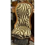 A Victorian carved and moulded mahogany framed chair upholstered in Ralph Lauren zebra print,