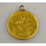 A George III guinea, date obscured, with soft soldered gilt metal ring attached Condition Report