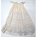 A Victorian cream silk Christening gown inset with lace,