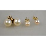 Two pairs of cultured pearl stud earrings with yellow metal fittings