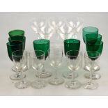 Five aperitif glasses, the bowls having engraved wavy lines on a facetted stem, the foot engraved R.