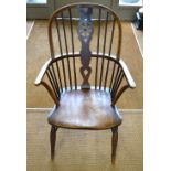 A late 19th century hoop back elbow chair with elm seat