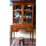 A late 19th century Sheraton revival satinwood inlaid figured mahogany bookcase secretaire,