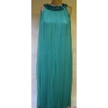 A 1970's aquamarine chiffon evening dress with beaded and sequinned neckline, 43 cm across chest