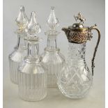 A set of three 19th century decanters of mallet form having vertical ribbed cut bodies and necks,