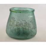 An antique Persian green glass mosque lamp with folded rim and etched decoration of Arabic