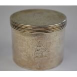 A 19th century white metal cylindrical box and cover engraved with a crest, 5.