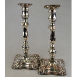 A pair of Old Sheffield plate baluster candlesticks on moulded square bases,