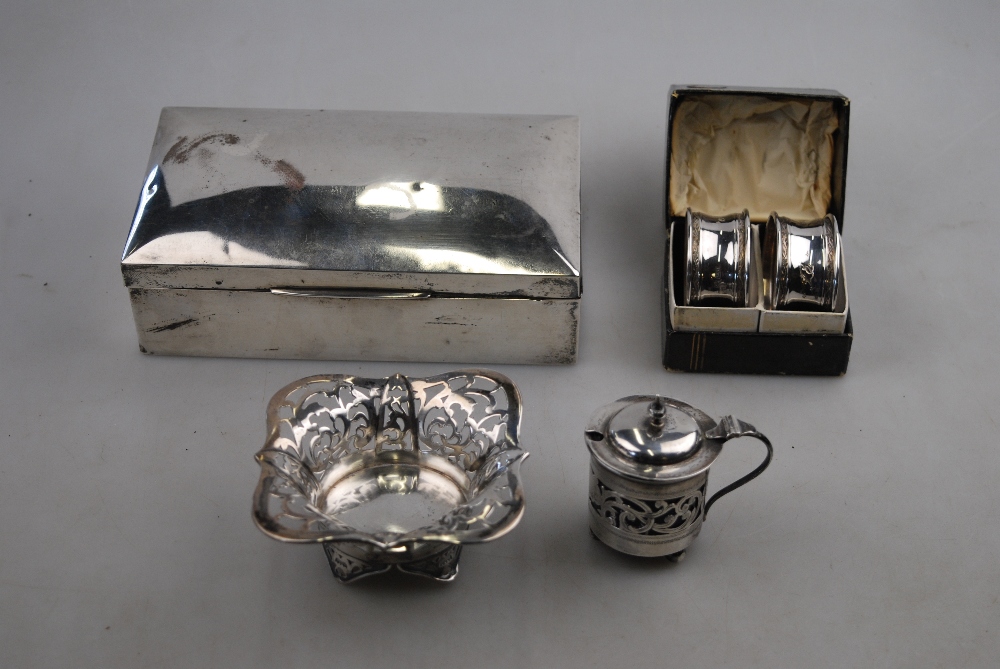 An engraved silver vesta case, Birmingham 1921, to/w a hip-flask, cream jug, pint mug, napkin rings,